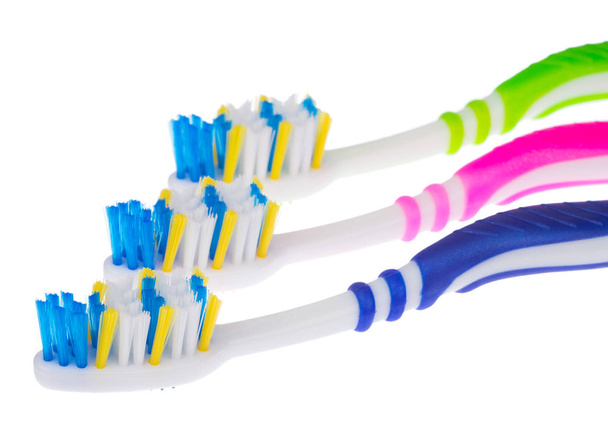 Tres nuevos cepillos de dientes
 - Foto, Imagen