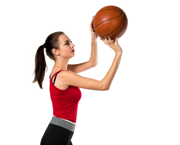 Bella donna sportiva che gioca a basket
 - Foto, immagini