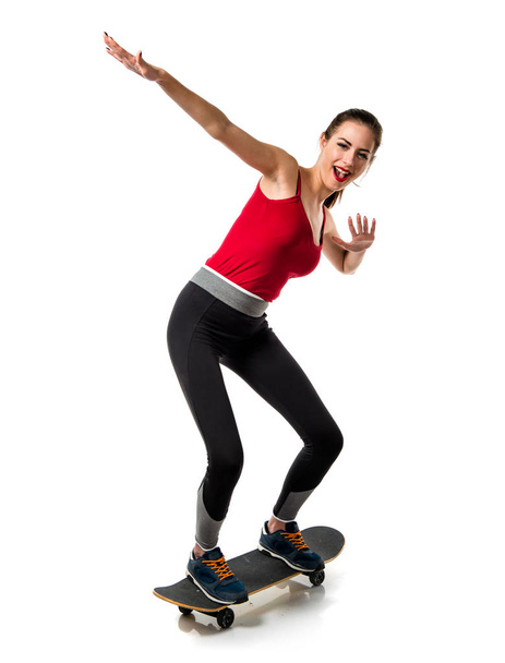 Pretty sport woman with skate - Фото, изображение