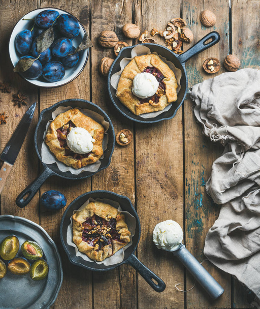 plums and walnuts crostata pies - 写真・画像