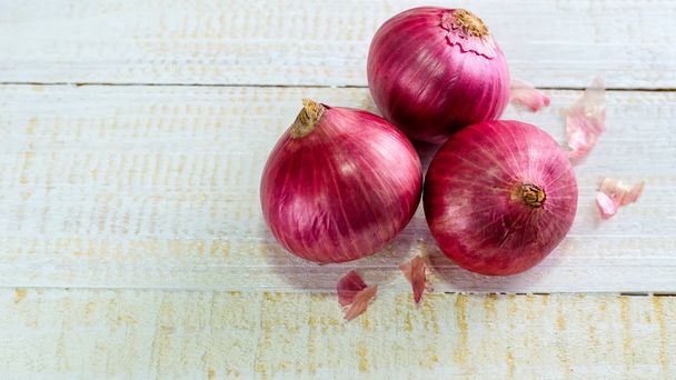 red onions on rustic wood - Photo, Image