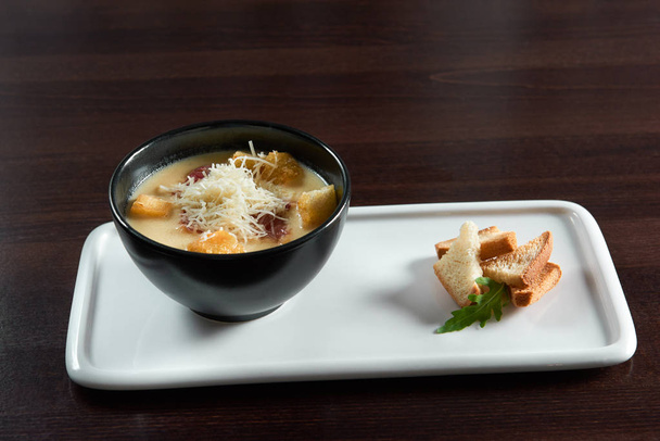 Cheese soup with croutons on a restaurant table - Photo, Image