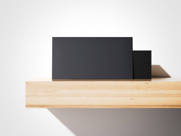 Stack of black business cards on a shelf. 3d rendering - 写真・画像
