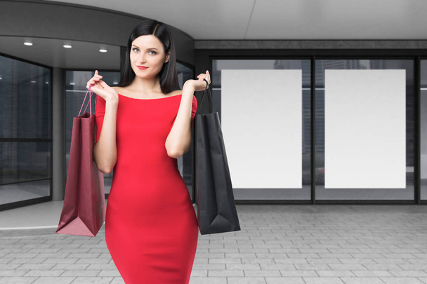 Woman in red near a mall, close up - Foto, immagini