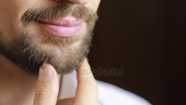 The mans smile.A man with a beard smiling. Close-up. sexy lips - Séquence, vidéo