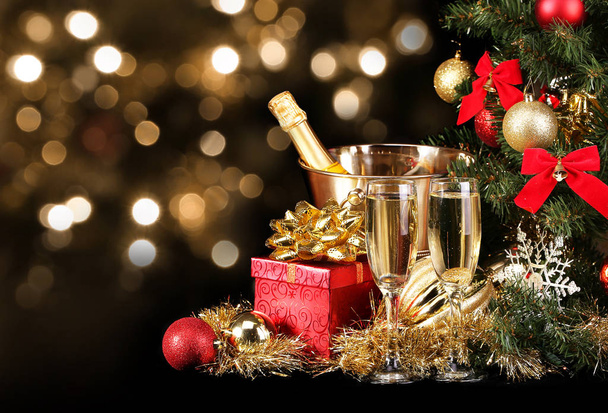 Christmas or New Year's Eve. Champagne and Presents over Black  - Photo, Image