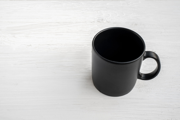 xícara de café preto No chão de madeira
. - Foto, Imagem