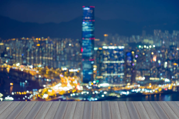 Opening wooden floor, twilight blurred lights Hong Kong city downtown - Photo, Image