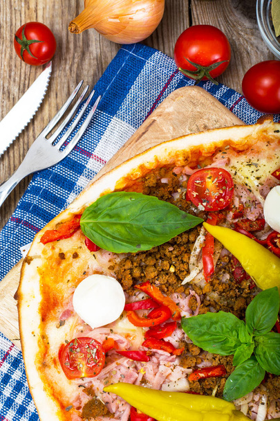 Rustic Italian Pizza on a Thin Pastry with Minced Pork, Ham, Tom - Photo, Image