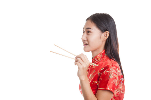 Asian girl in chinese cheongsam dress with  chopsticks. - Fotoğraf, Görsel