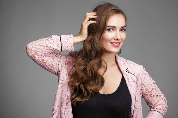 Beautiful young woman in pink lace jacket  - Zdjęcie, obraz