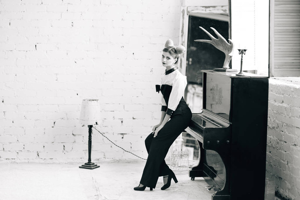 Stylish young woman in black pants, white shirt. portrait of a business lady. - Valokuva, kuva