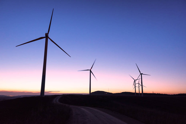 Wind farm silhouette at dusk - Photo, Image