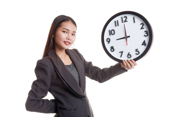 Young Asian business woman with a clock. - Zdjęcie, obraz