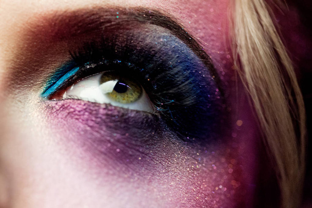 Female eye close-up, creative make-up. Purple tones - Фото, зображення
