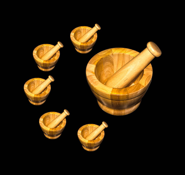 Wooden mortar with pestle. Isolated on black background - Photo, Image