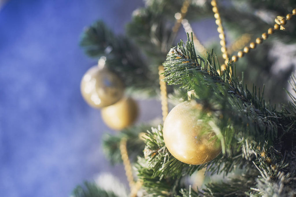 Decorations on the Christmas tree branches with shallow depth of field - Photo, Image