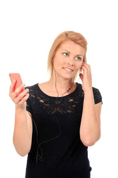 lady wearing earphones connected to smartphone - Zdjęcie, obraz