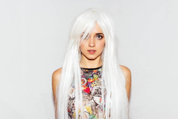 Fashion photo of beautiful anime woman. Cheerful funny playful young cute girl in colorful clothes and white wig. - Φωτογραφία, εικόνα