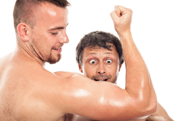 Funny men looking at biceps - Фото, изображение