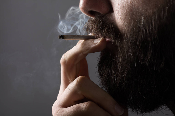 Man Smoking a Cigarette - Fotoğraf, Görsel