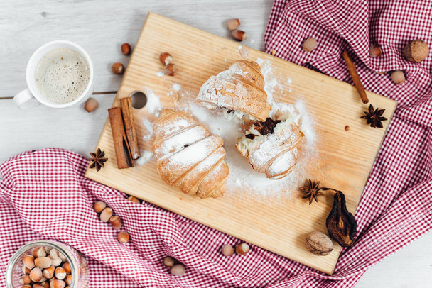 Fresh homemade croissants on a red napkin - Foto, afbeelding