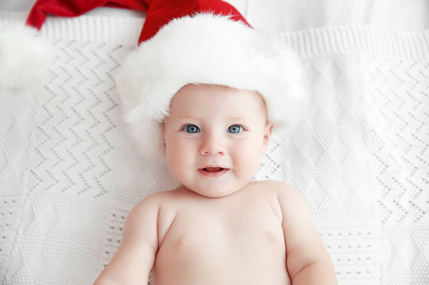 Little baby in Christmas hat   - Фото, зображення