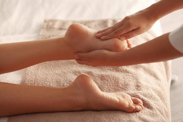 Foot massage in spa salon - Fotó, kép