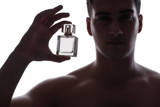 Sexy man with bottle of perfume - Foto, Imagem