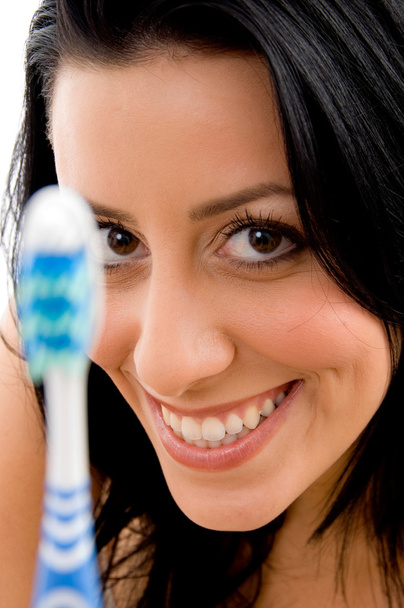 Smiling young woman with toothbrush - Foto, Bild