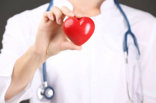 doctor with stethoscope holding heart - Zdjęcie, obraz