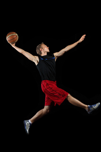 Basketball player with a ball - Фото, изображение
