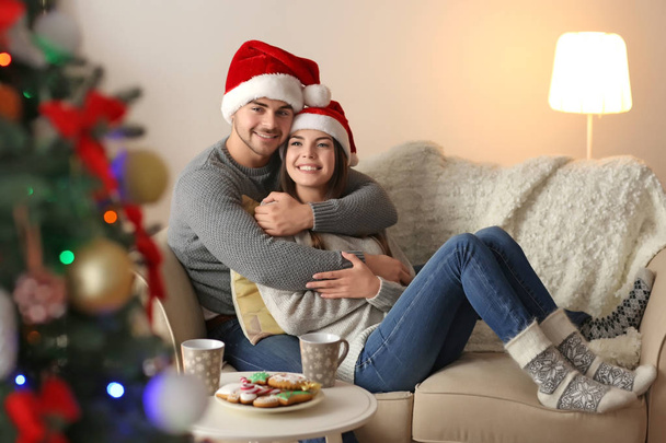 couple in Santa Claus hats - Photo, image