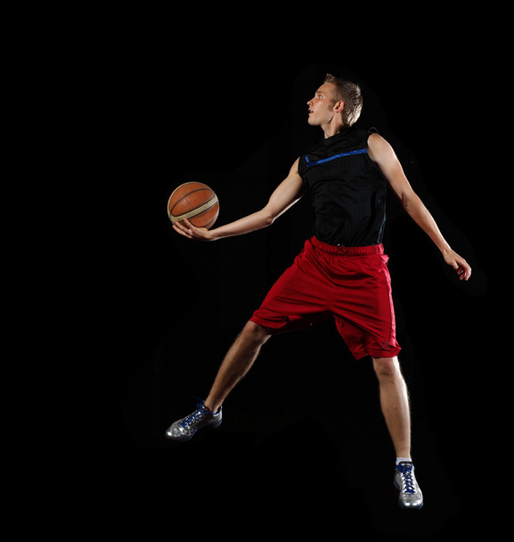 Basketball player with a ball - Foto, Bild