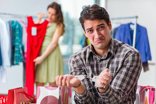 Man fed up with wife shopping in shop - Zdjęcie, obraz