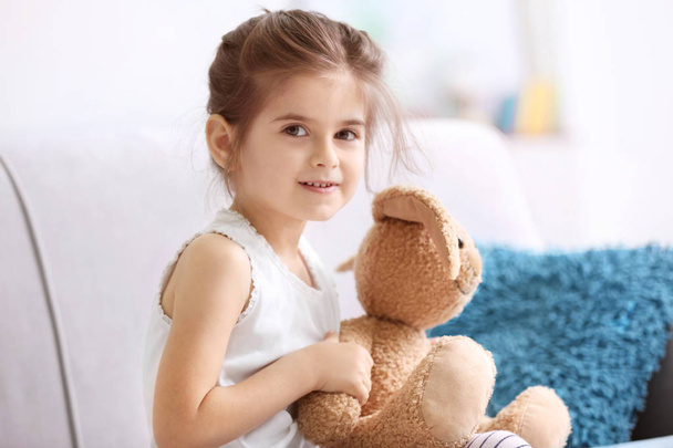 Funny little girl with toy - Zdjęcie, obraz
