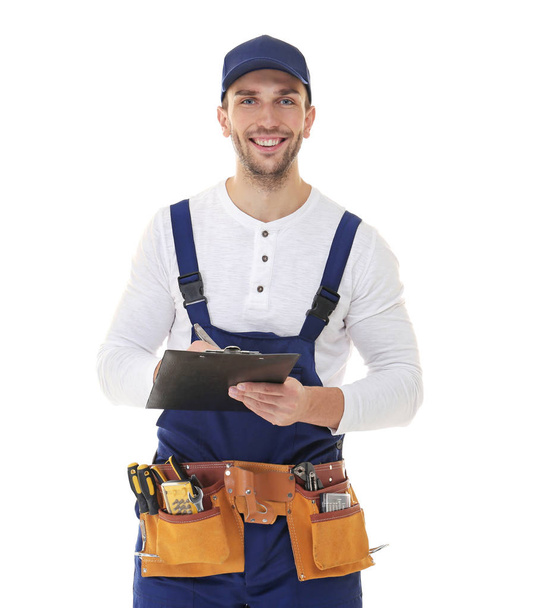 Plumber in uniform holding clipboard  - Photo, Image