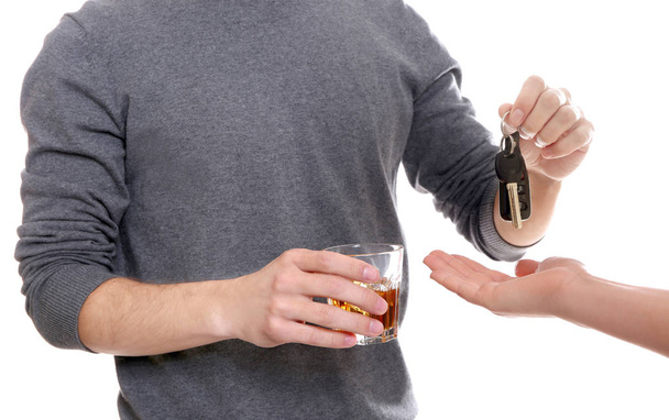 drunk man giving car key  - Foto, Imagen