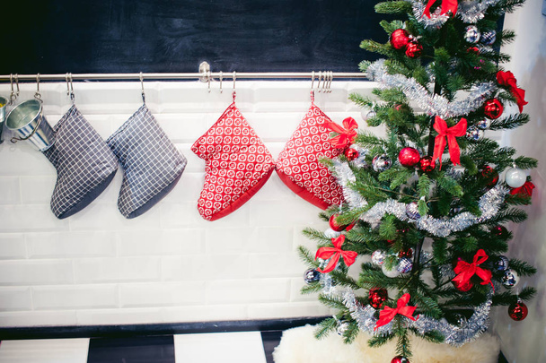 decoration festive home interior. Christmas sock and Christmas tree - Foto, Imagen