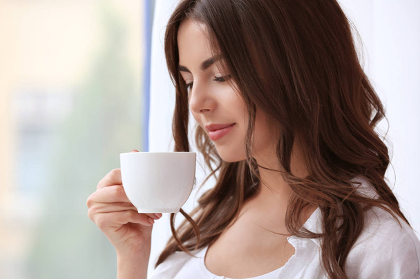 woman with cup of aromatic coffee  - Foto, Imagem