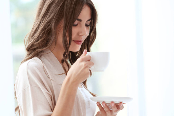 woman with cup of aromatic coffee  - Foto, Imagem