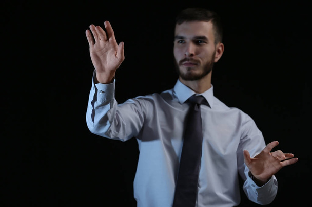 Businessman hands  on dark background - Photo, Image