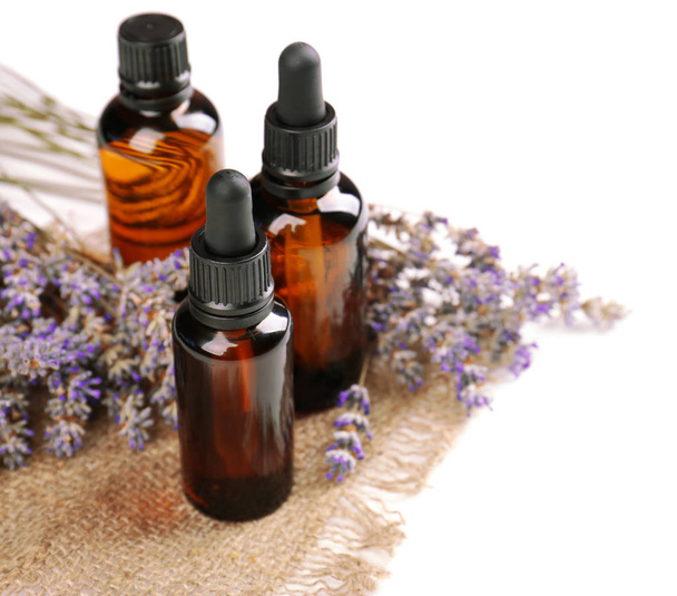 Bottles with essential oil and lavender - Фото, изображение