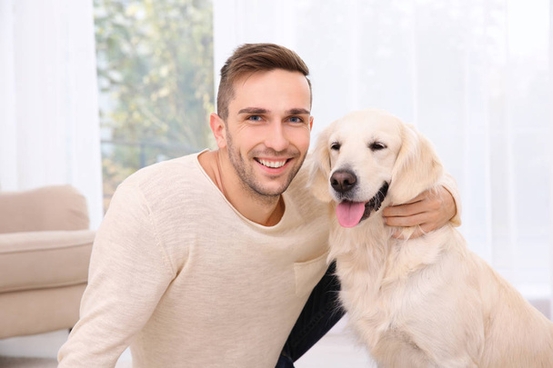 Handsome man with dog  - Photo, image
