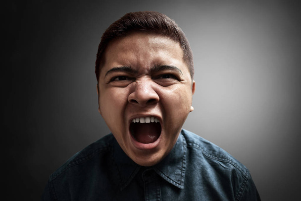 Young angry man - Фото, изображение