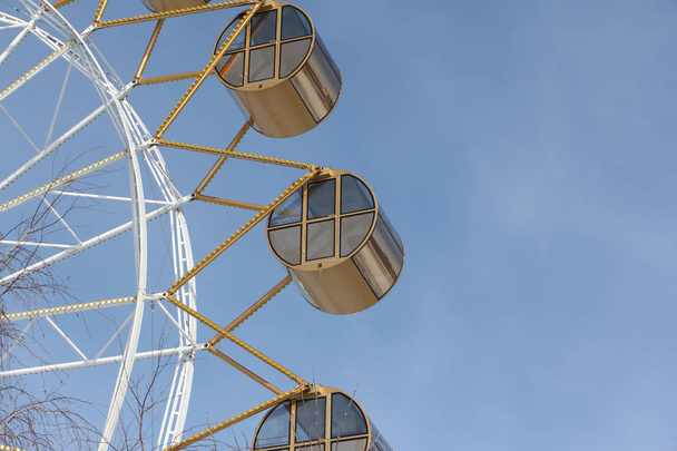 Ferris wheel  with the round closed cabins against the sky - Foto, Bild