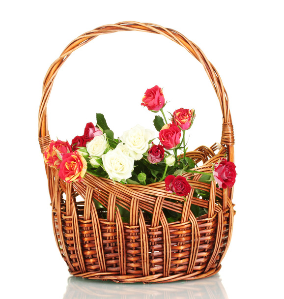 Bouquet of beautiful roses in a wicker basket isolated on white - Zdjęcie, obraz