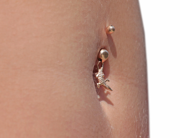 Piercing of a female navel - Photo, Image