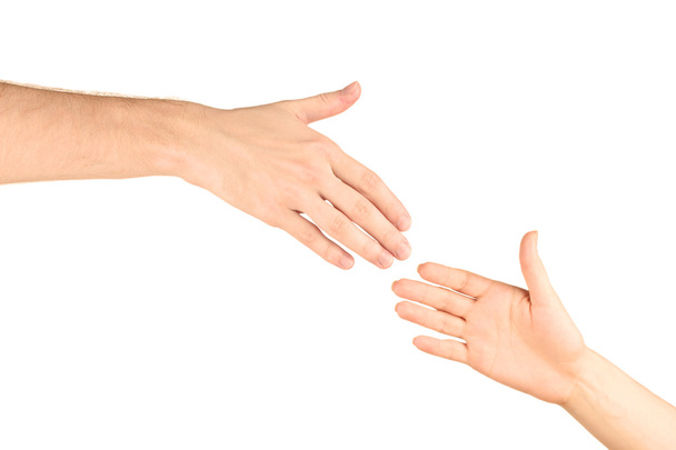 Women's hand goes to the man's hand on white background - Zdjęcie, obraz