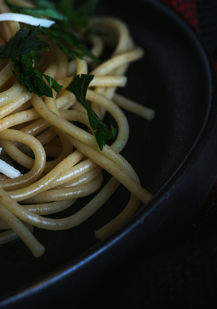Spaghetti and tomatoes with herbs  - 写真・画像